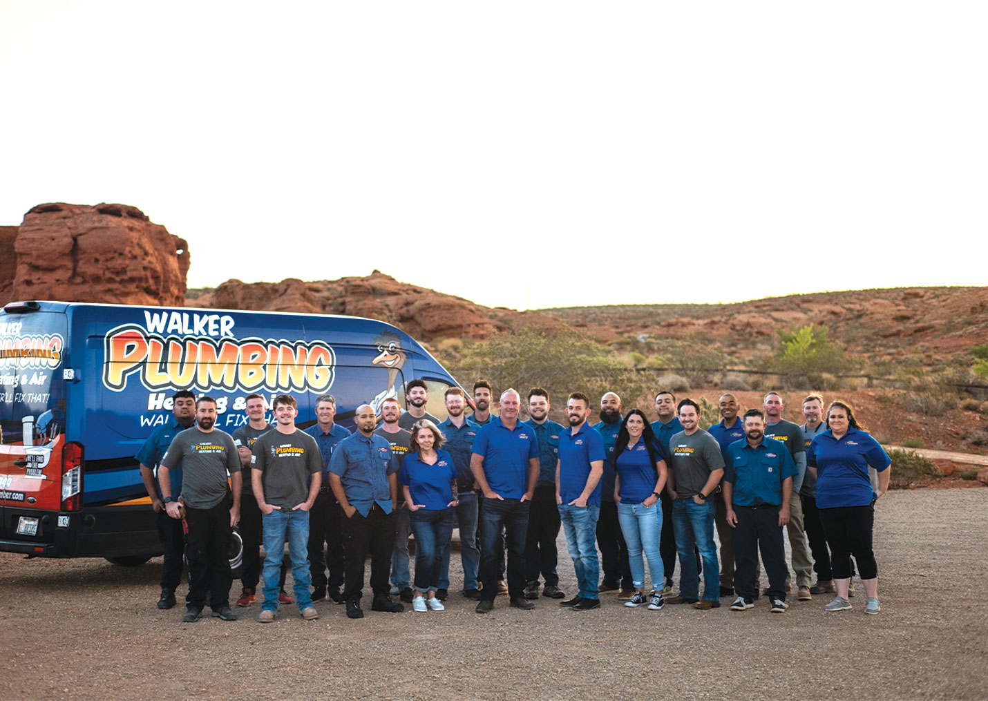 Walker Plumbing, Heating & Air team beside their branded service van